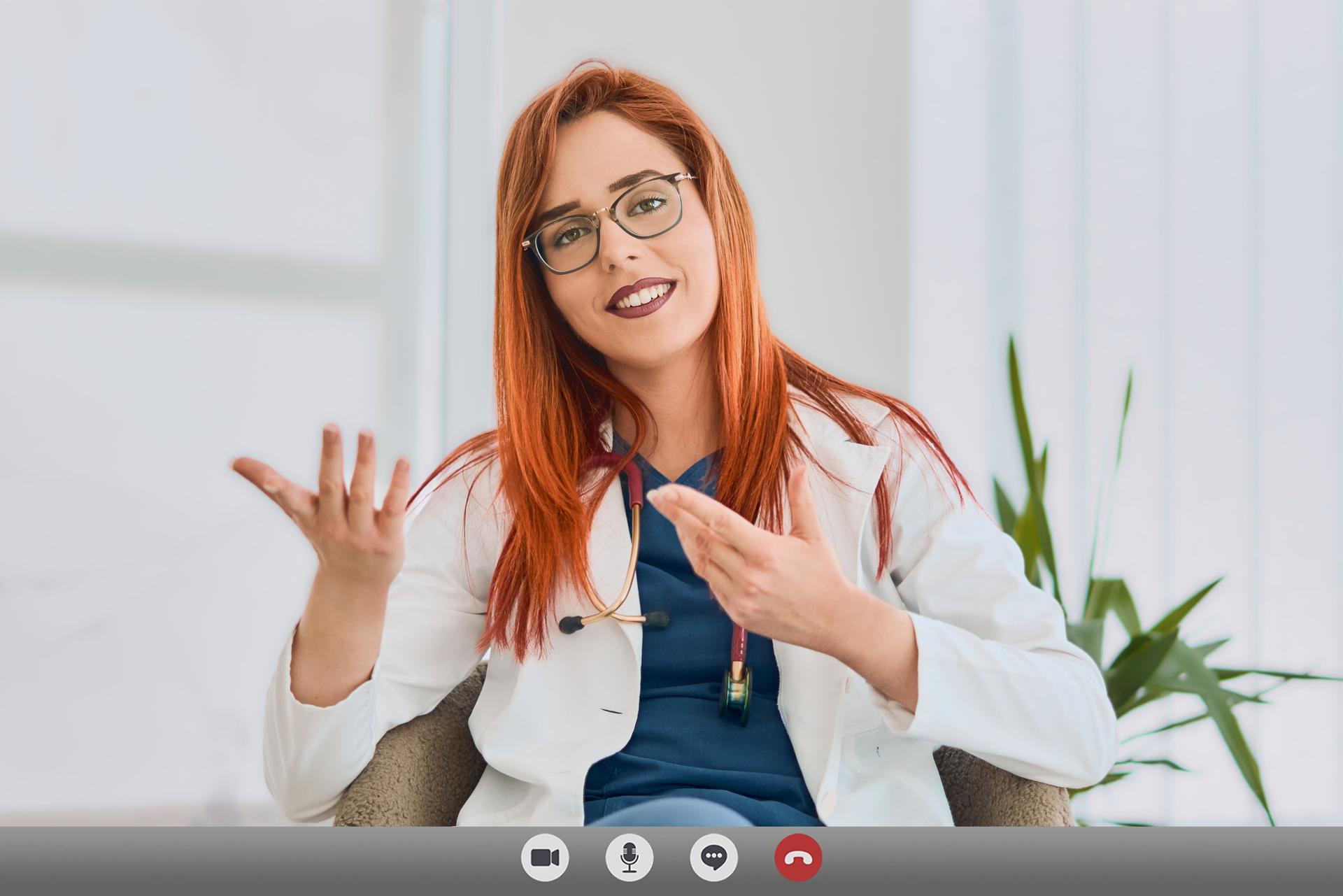 Video Chat with patient by doctor. Online video chat with patient by female doctor, camera view - telehealth concept.