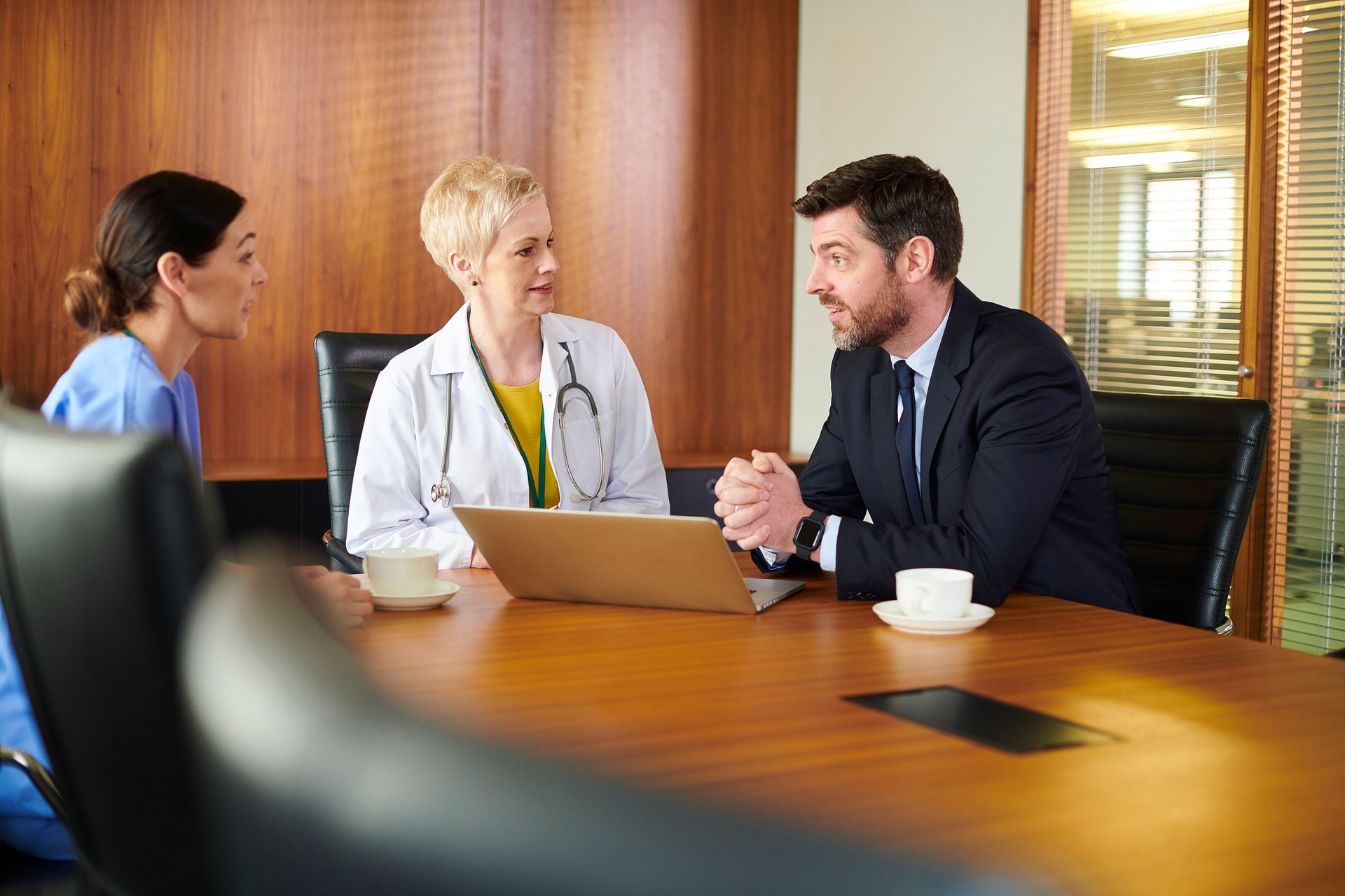pharmaceutical sales rep with medical team